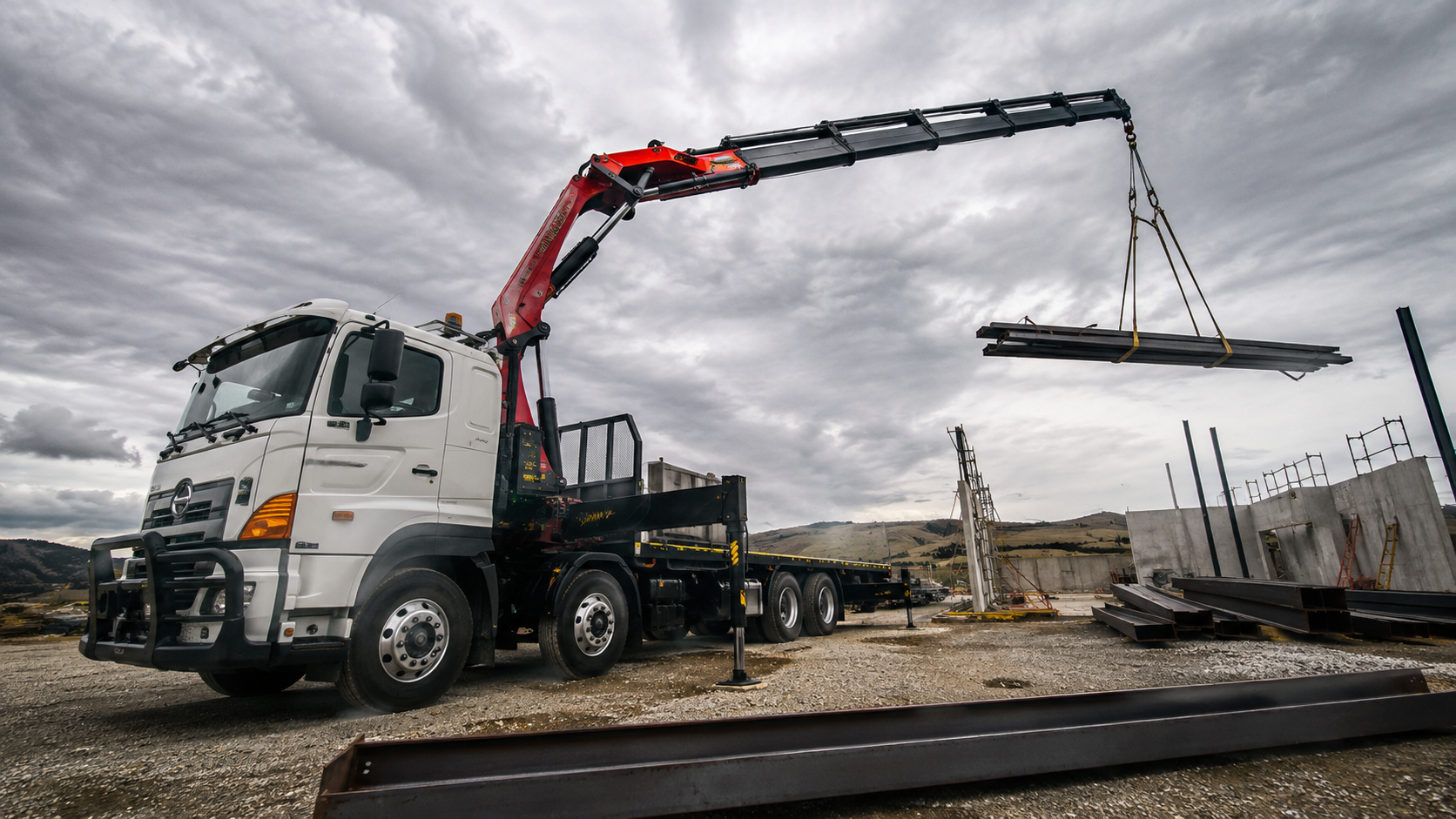 Commercial hiab lifting steel on construction site Hamilton